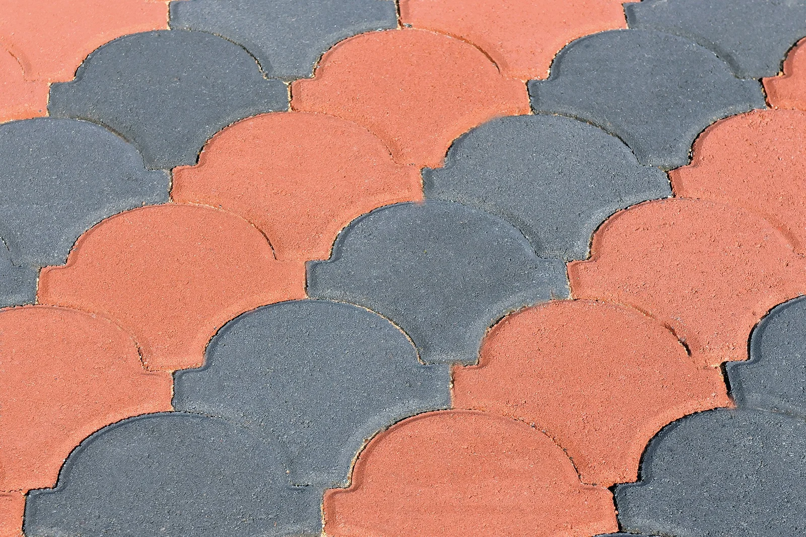 Decorative Conleaf-style paving in a landscaped outdoor area