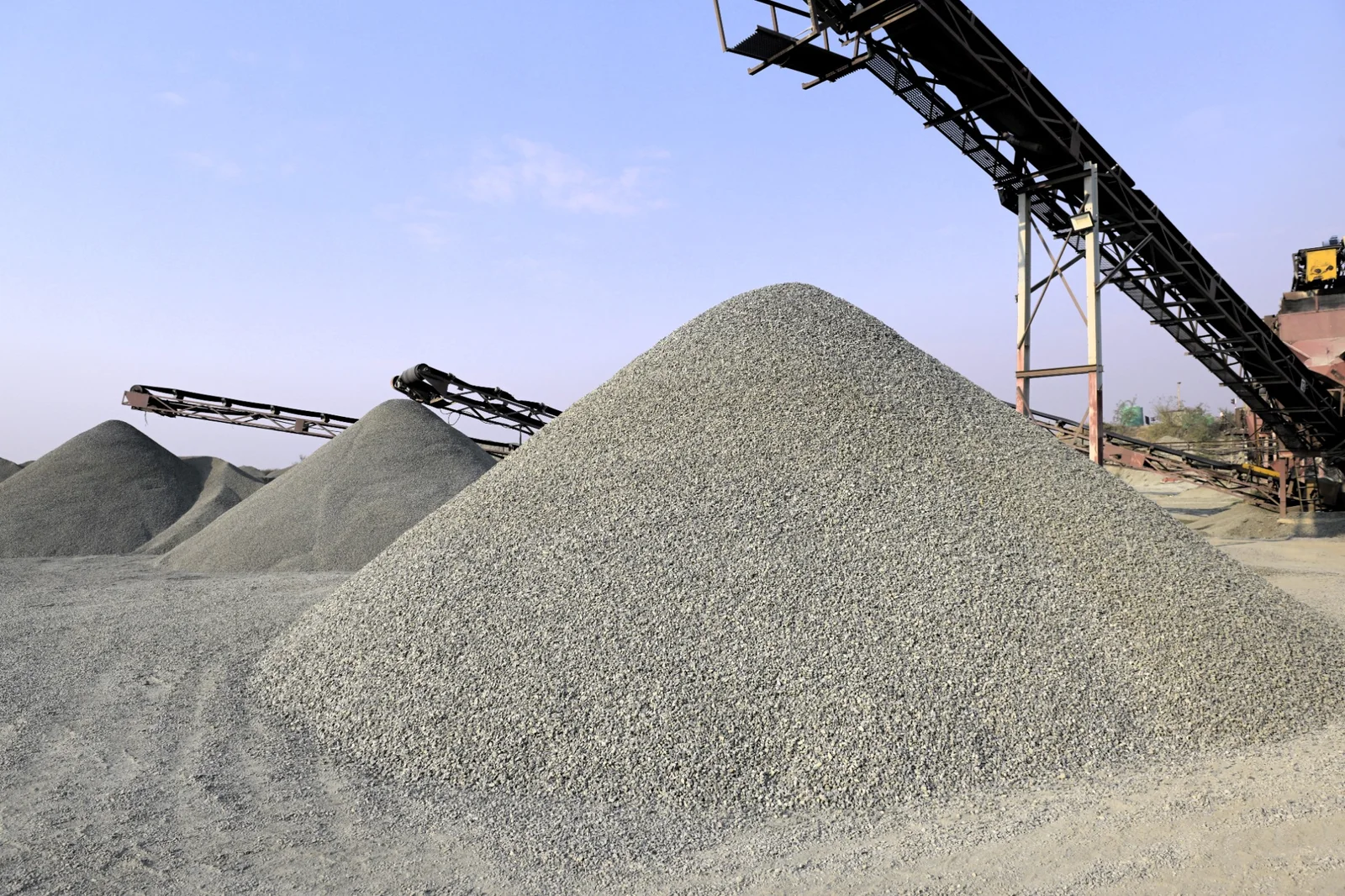 Stone aggregate stockpiles in a professional quarry environment